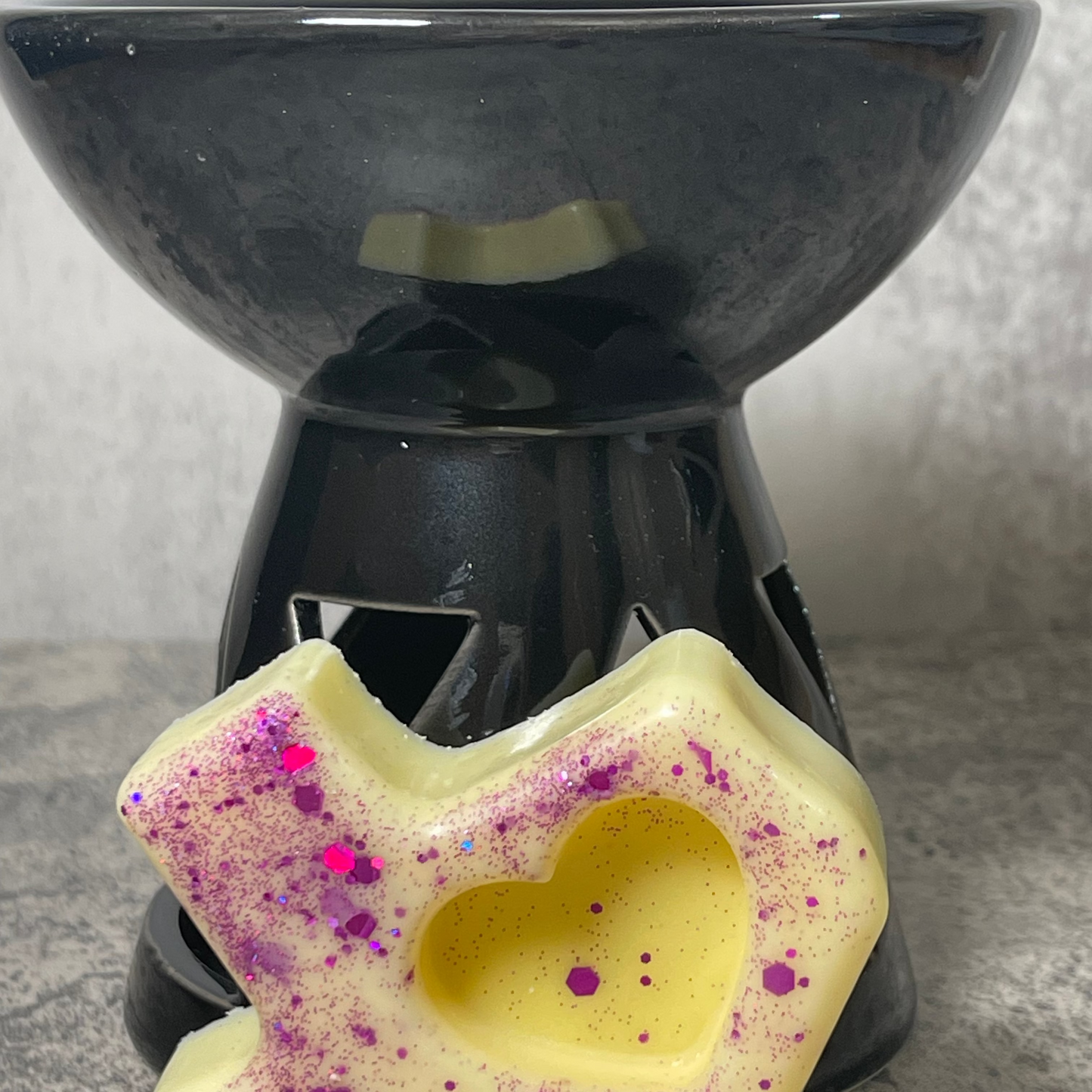 Black modern tea light warmer with TX shaped wax melt