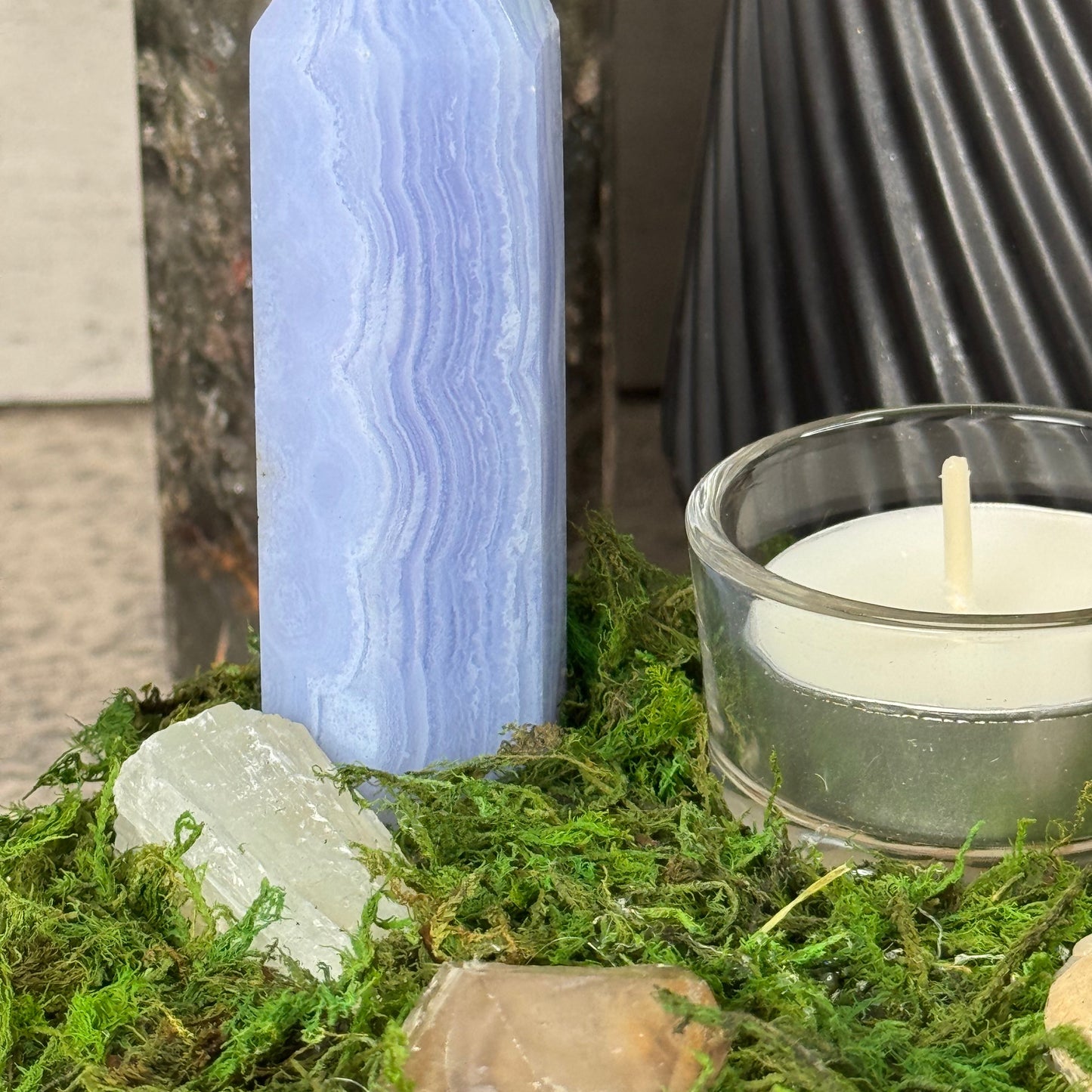 Crystal with a candle on a natural background