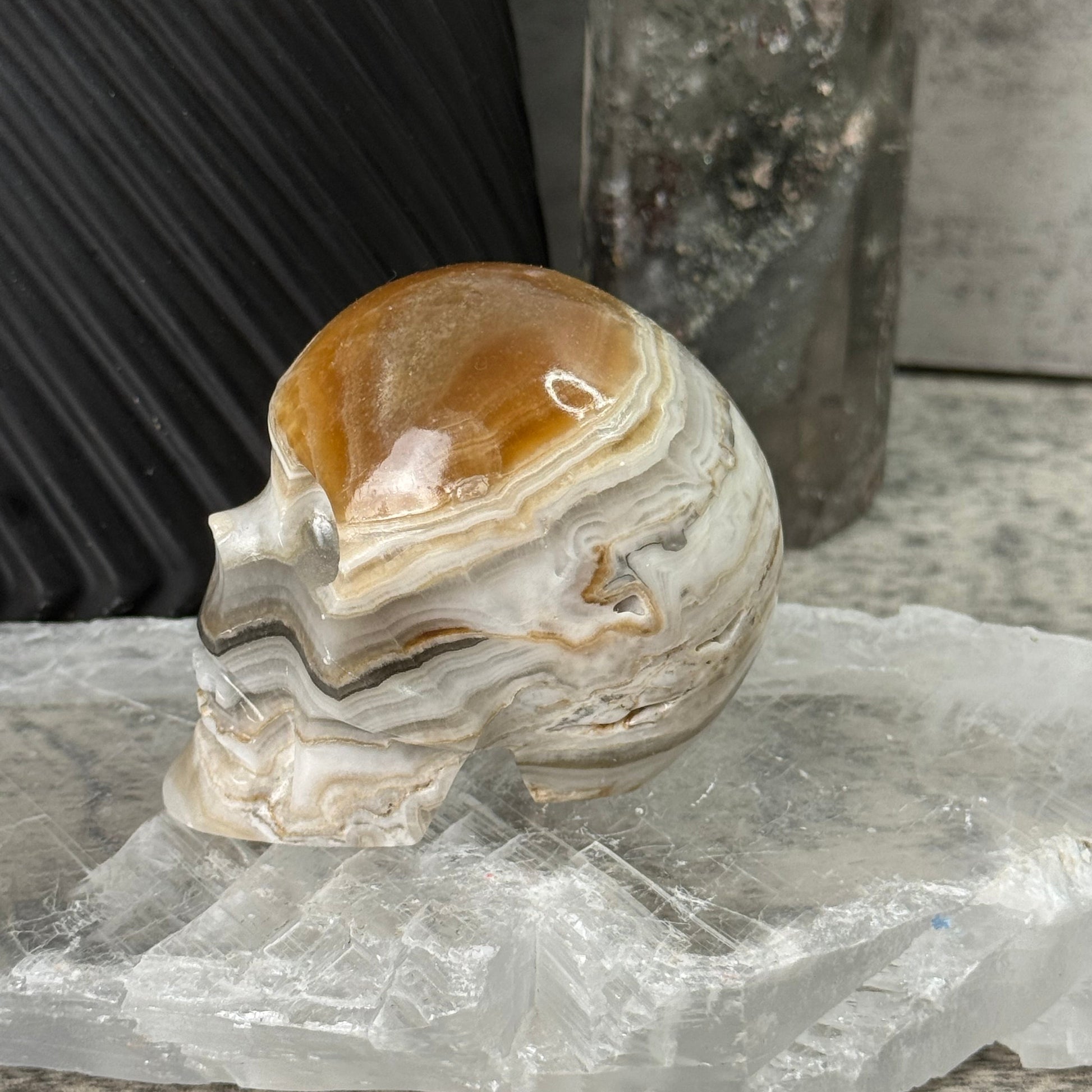 Decorative stone sculpture on a textured surface