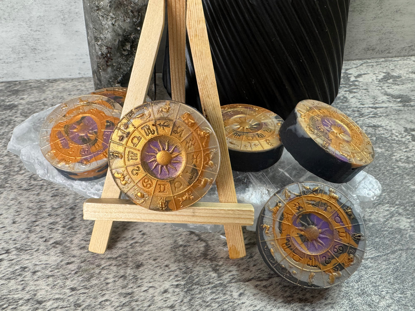Decorative items with astrological designs on a textured surface