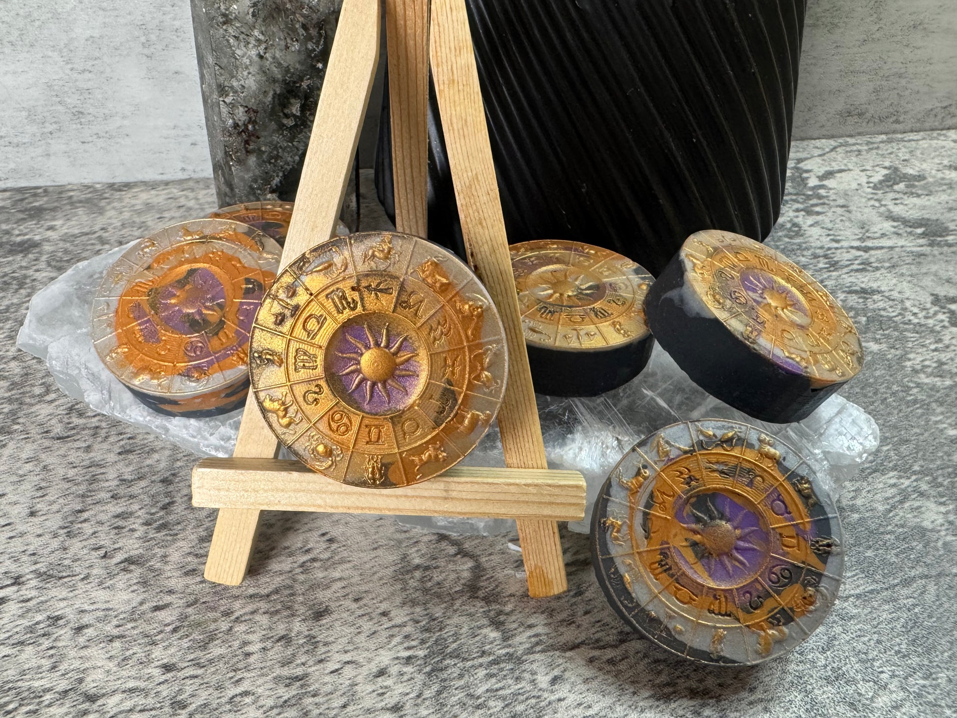 Decorative items with astrological designs on a textured surface