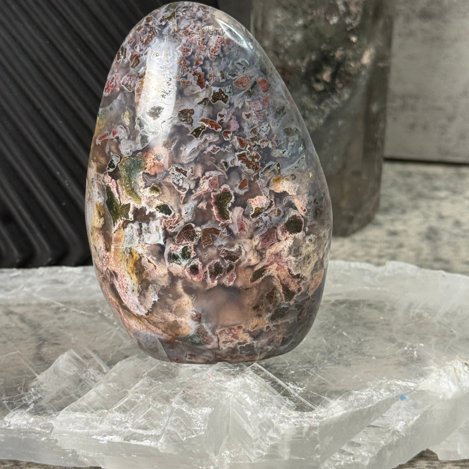 Polished stone with a rough texture on a blurred background