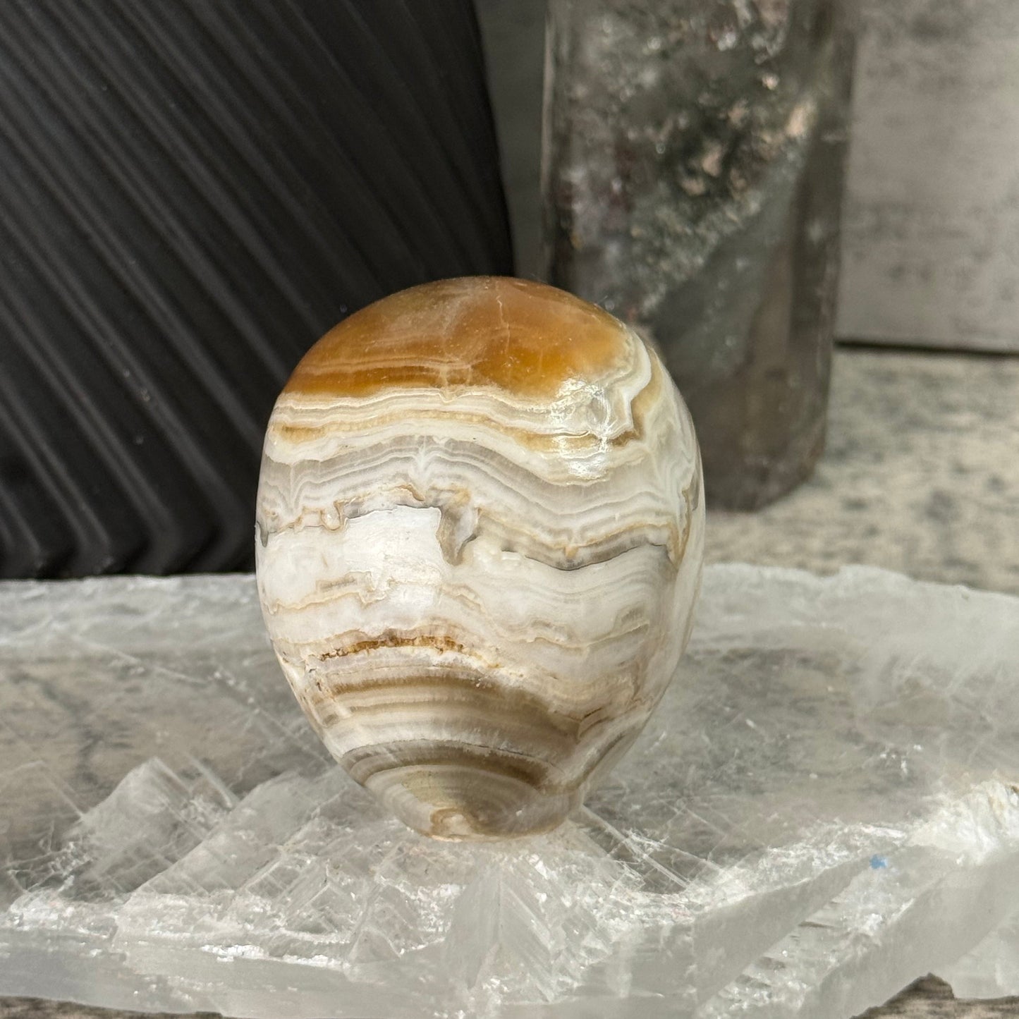 Decorative stone sphere on a textured surface