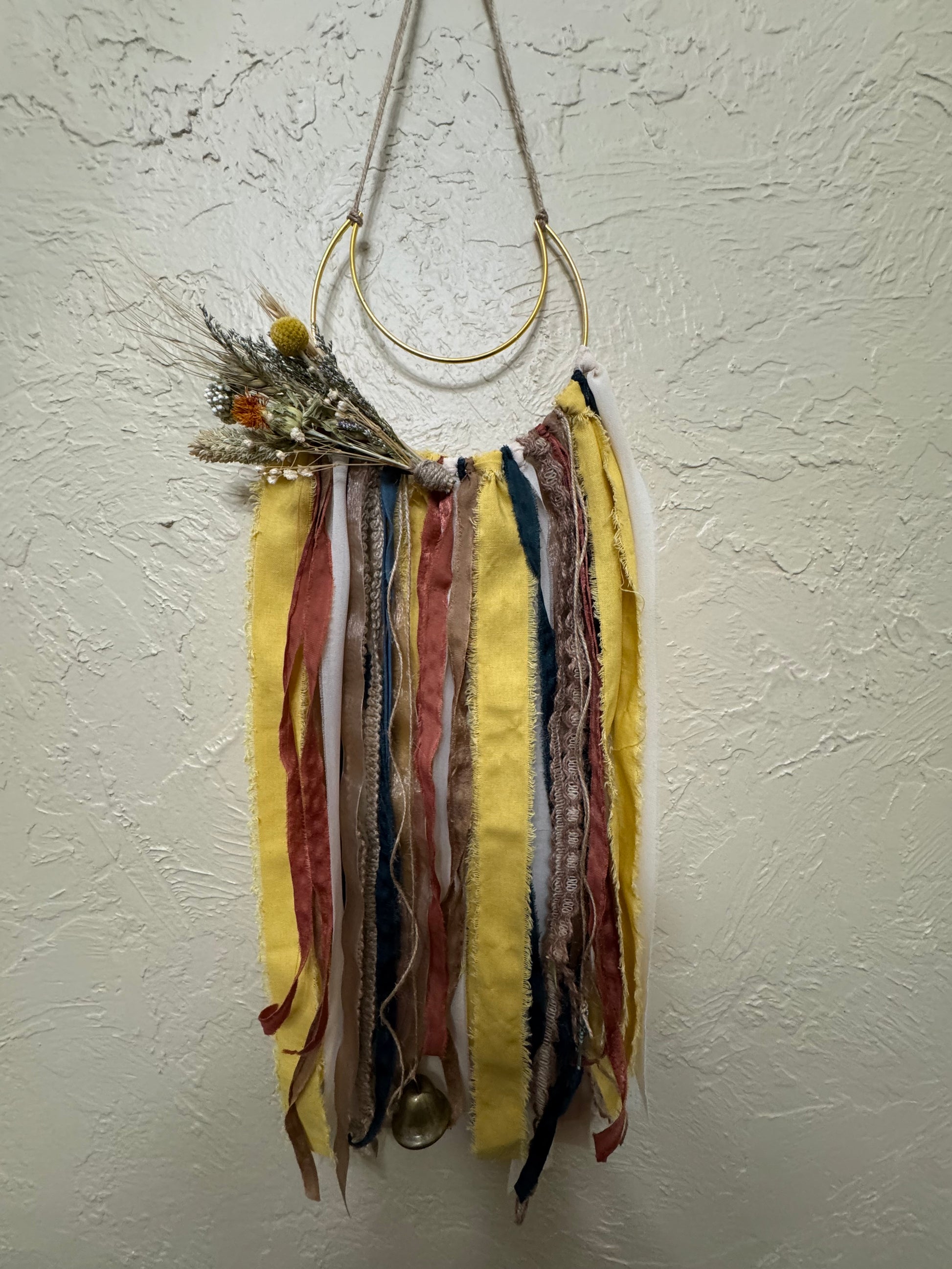 Colorful fabric feathered item on a white background