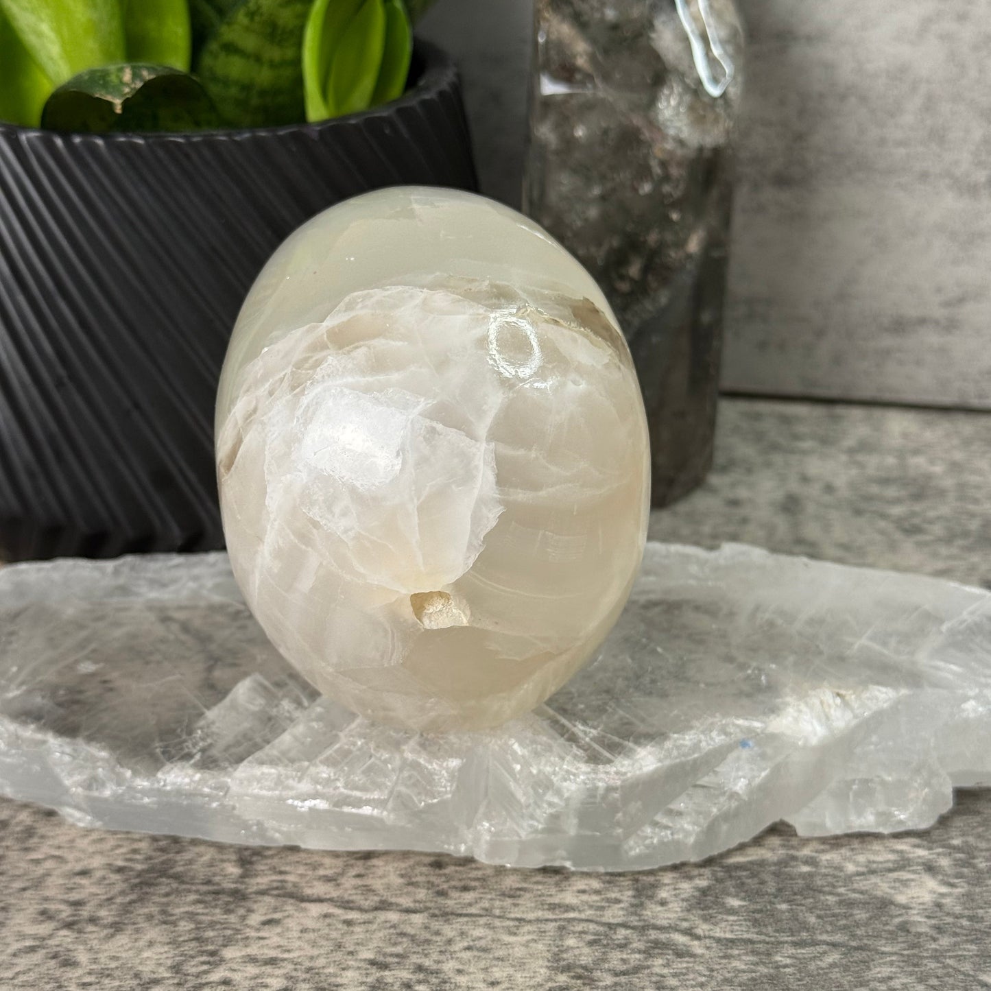 Decorative stone with a candle inside on a stone surface