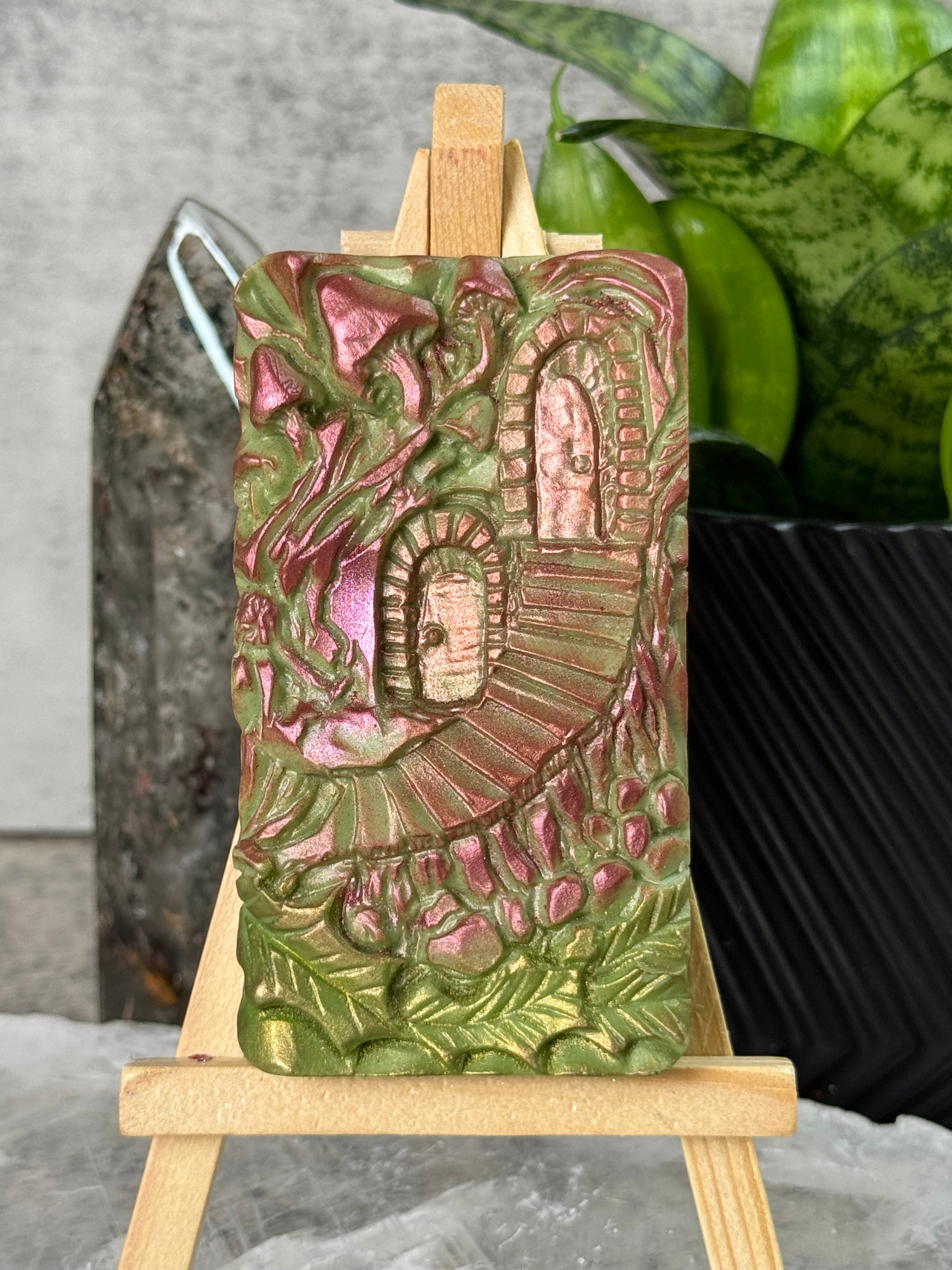 Decorative wooden box with intricate carvings on a textured surface