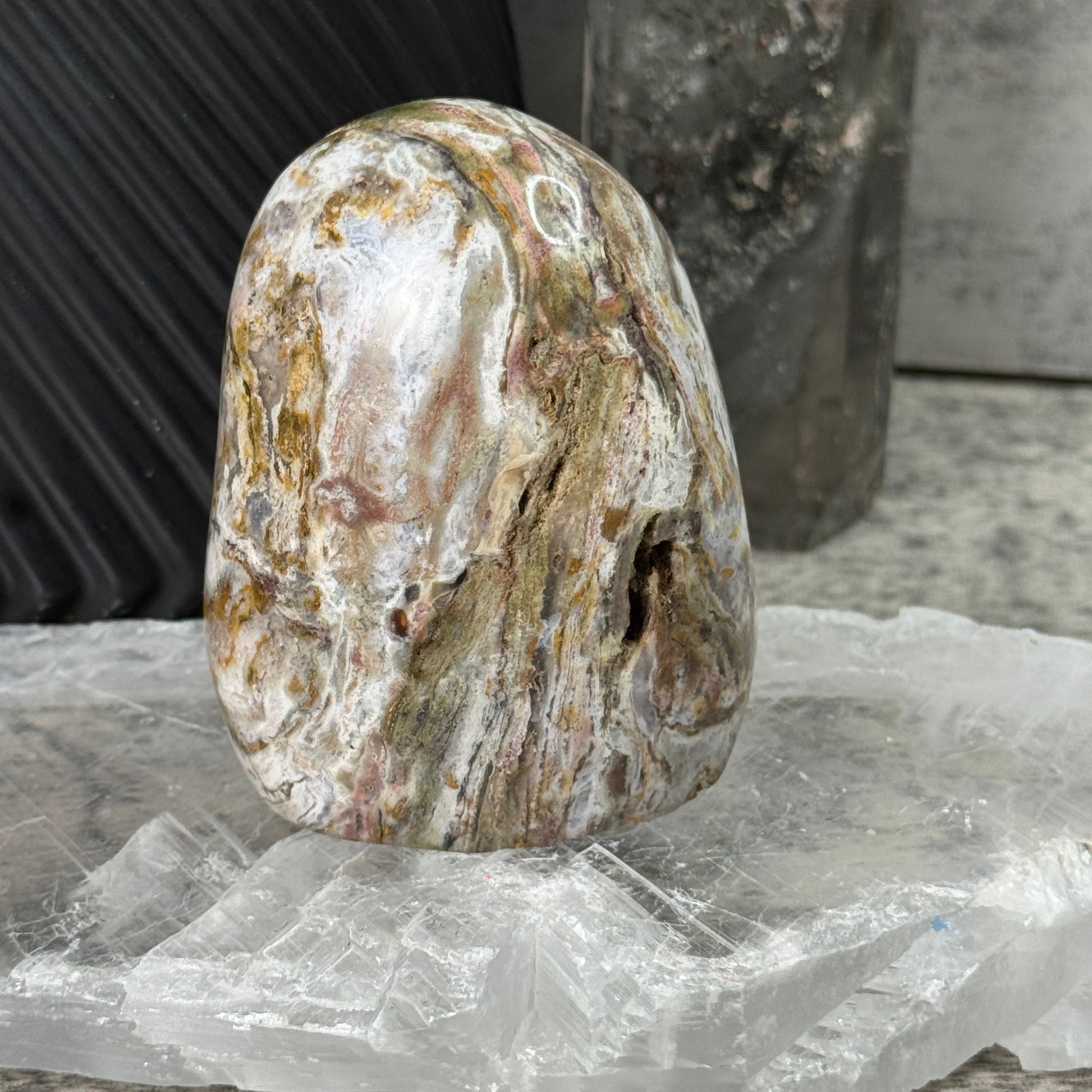 Close-up of a textured stone object with a blurred background